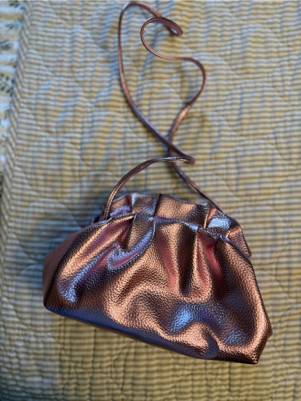 Metallic pink ruffle clutch